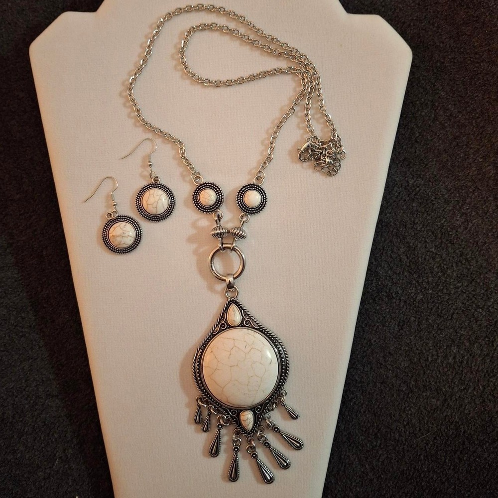 Necklace and earring set with white cracked stone pendants set in silver.